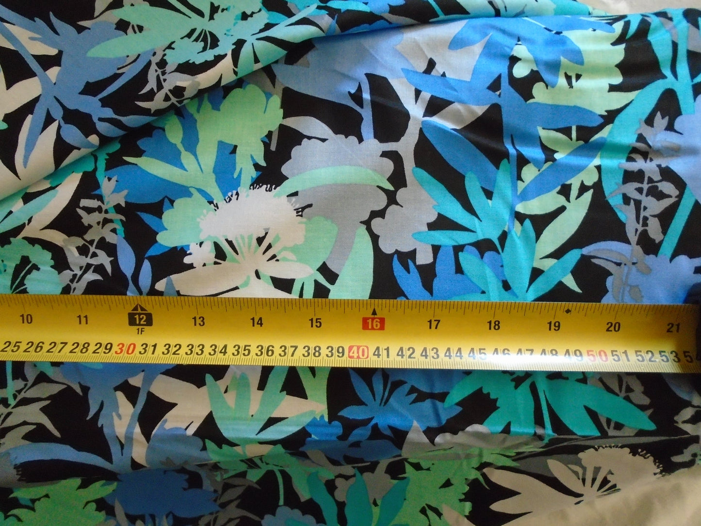 mixed floral/leaves  on black